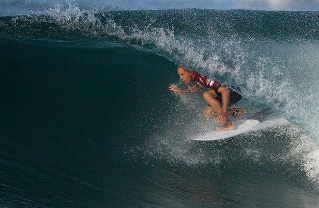 In this May 12, 2015 file photo, U.S. surfer Kelly Slater competes in the 2015 Oi Rio Pro World Surf League competition at Barra da Tijuca beach in Rio de Janeiro, Brazil.