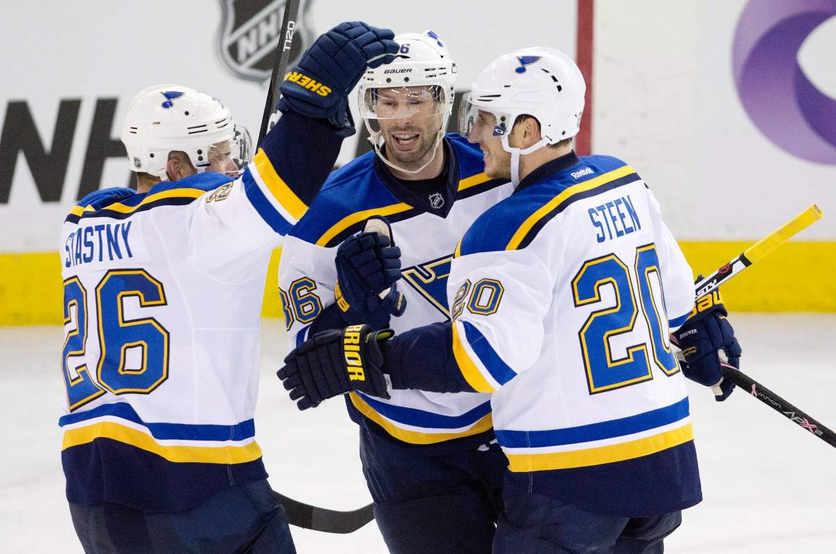 St. Louis Blues’ Paul Stastny (26), Troy Brouwer (36) and Alexander Steen (20) celebrate a goal against the Edmonton Oilers during third period NHL action in Edmonton, Alta., on Thursday October 15, 2015.