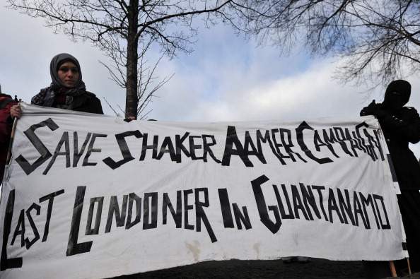 Protesters take part in a demonstration in London on December 11, 2010 in support of Shaker Aamer, the last British resident held at the US-run Guantanamo Bay camp. 