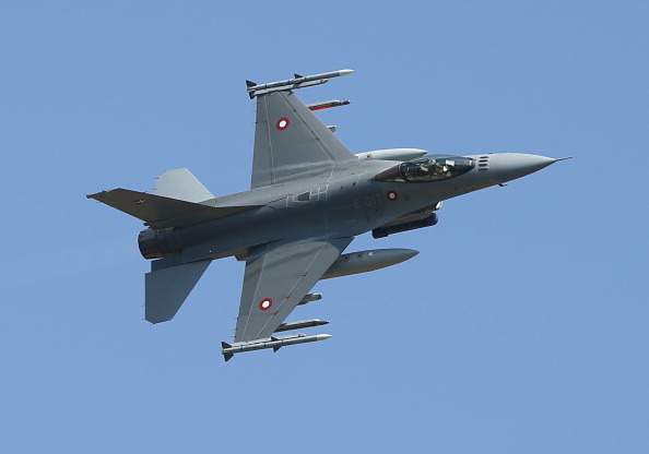 An F-16 fighter plane of the Royal Danish Air Force simulates an attack during a demonstration while participating in the NATO "Spring Storm" military exercises on May 19, 2014 near Helme, Estonia.  (Photo by Sean Gallup/Getty Images).
