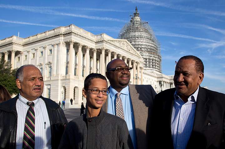 Ahmed Mohamed, 14, accompanied by, from left, his father Mohamed Elhassan Mohamed, Ron Price, and his uncle Aldean Mohamed, take part in a news conference on Capitol Hill in Washington, Tuesday, Oct. 20, 2015.