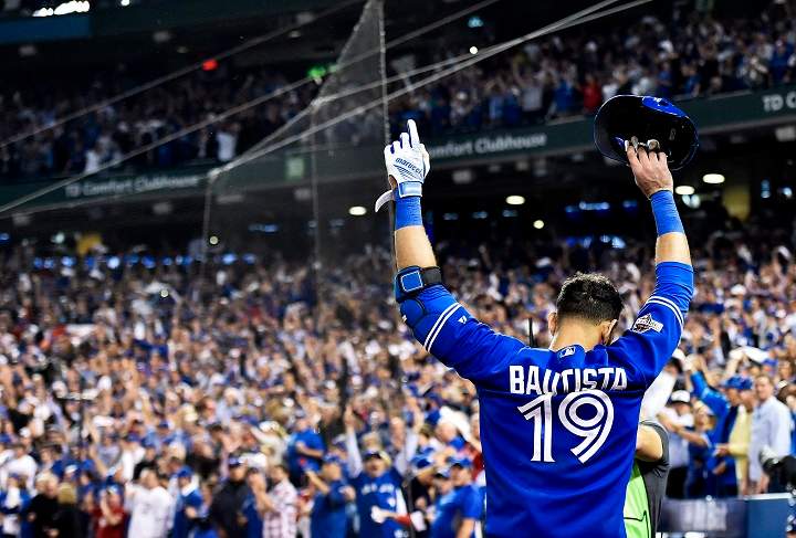 Toronto Blue Jays right fielder Jose Bautista acknowledges the crowd after hitting a three-run home run against the Texas Rangers during seventh inning game five American League Division Series playoff baseball action in Toronto on Wednesday, October 14, 2015.
