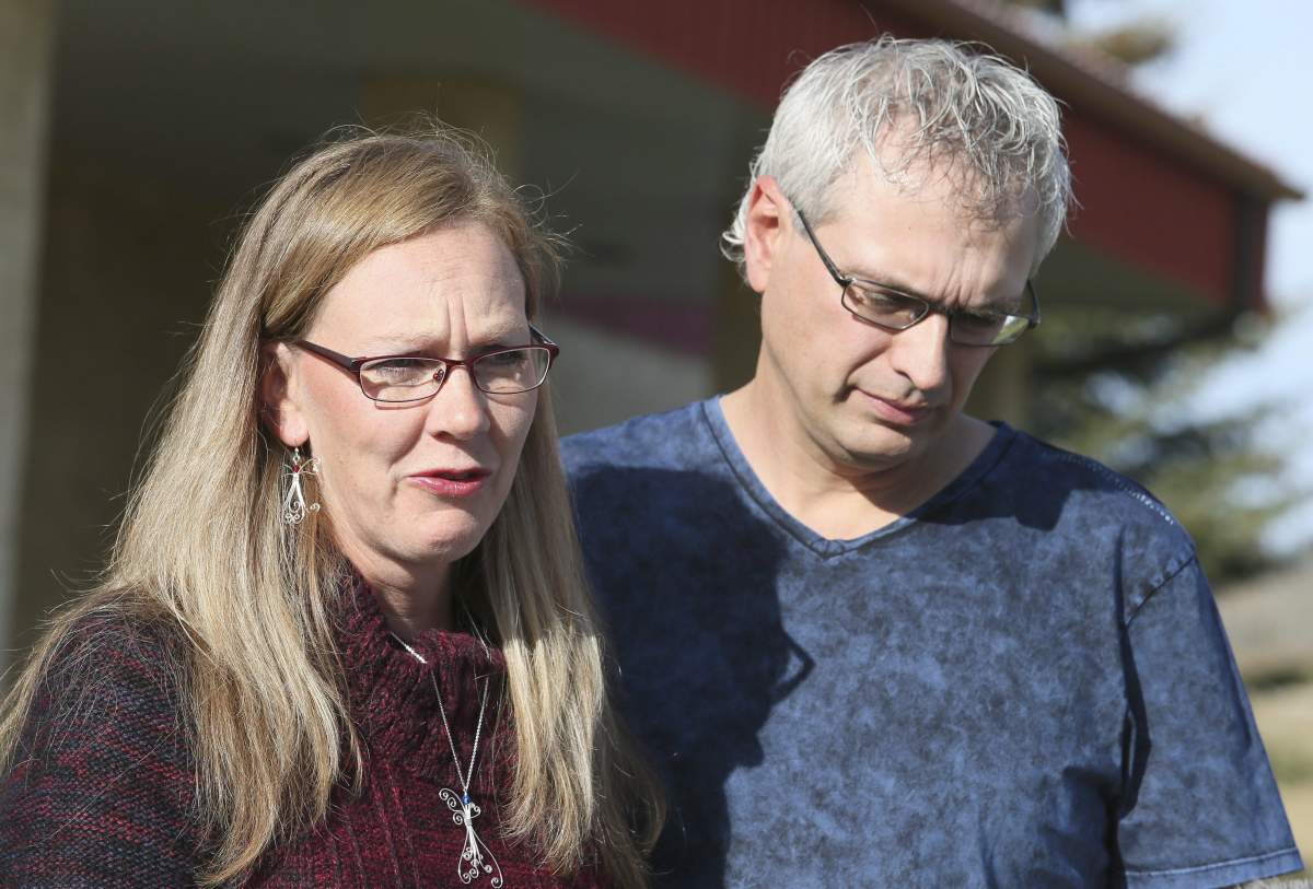 Roger and Bonita Bott make a statement to the media at the Withrow Gospel Mission in Withrow, Alberta, Wednesday, October 21, 2015. Their children Catie, 13, Dara, 11, and Jana, 11, were playing on a truck loaded with canola on October 13 when they were buried by the seed.