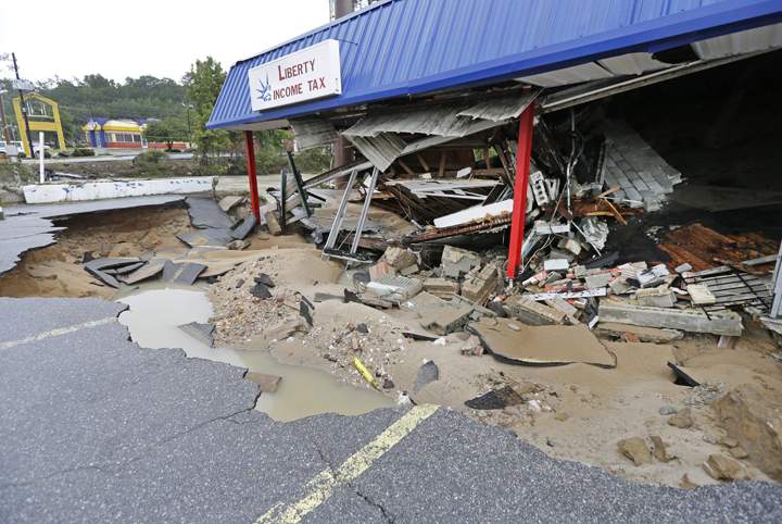 A business is destroyed by flooding in Columbia, S.C., Monday, Oct. 5, 2015.