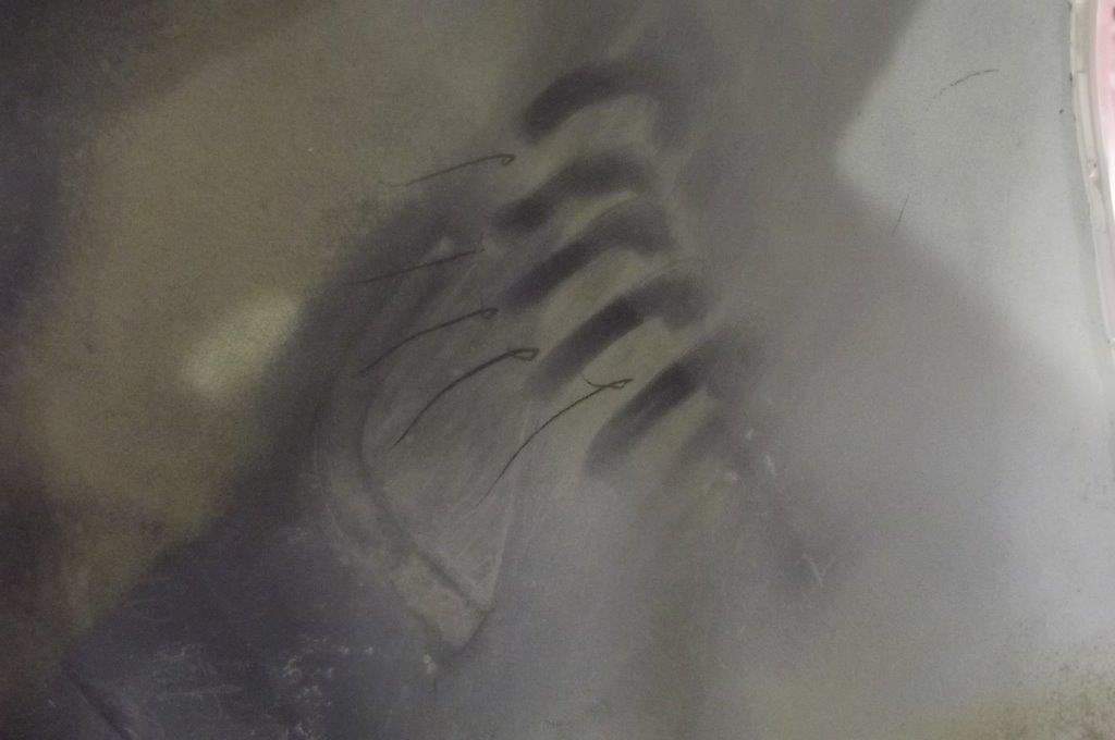Claw marks can be seen on an inside part of a vehicle in this file photo.
