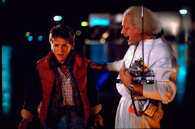 Michael J. Fox, left, as Marty McFly and Christopher Lloyd as Dr. Emmett Brown appear in a scene from the 1985 film, ‘Back to the Future’, in this undated handout photo.