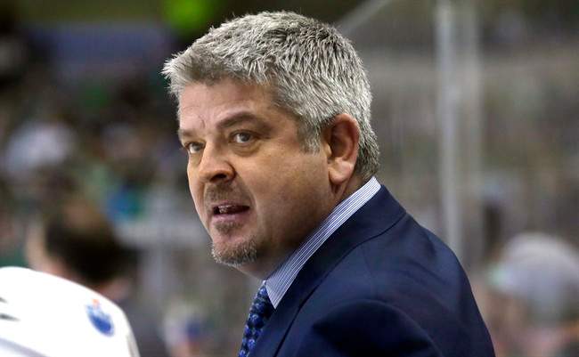 Edmonton Oilers head coach Todd McLellan watches from the bench during the first period of an NHL hockey game against the Dallas Stars on Oct. 13, 2015, in Dallas. Todd McLellan of the Edmonton Oilers will coach the 23-and-under Team North America at the upcoming World Cup of Hockey. McLellan was picked by North America general managers Peter Chiarelli, his boss in Edmonton, and Stan Bowman of the Chicago Blackhawks. 