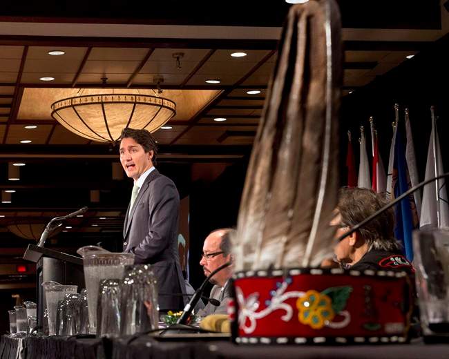 A First Nations headdress sits on a table as Federal Liberal Leader Justin Trudeau addresses the Assembly of First Nations congress in Montreal on July 7, 2015. 