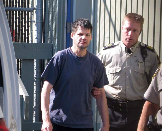 Accused child abductor Randall Hopley is led out of the Cranbrook, B.C. courthouse on September 14, 2011. THE CANADIAN PRESS/Bill Graveland