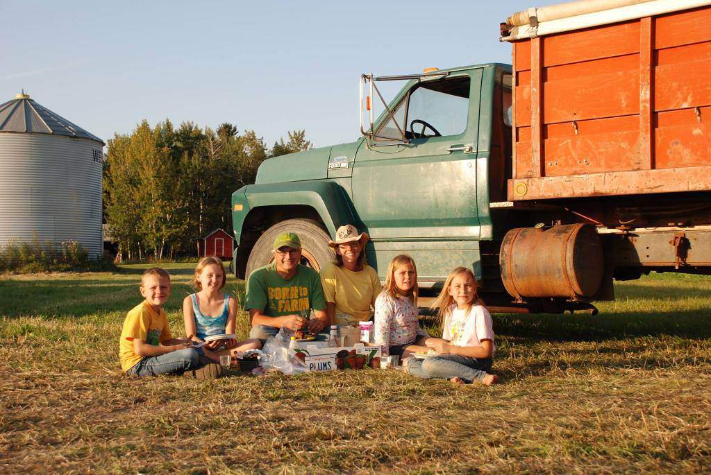 Parents Roger and Bonita Bott sit with their children Caleb, 9, Catie, 13, Jana, 11 and Dara, 11.