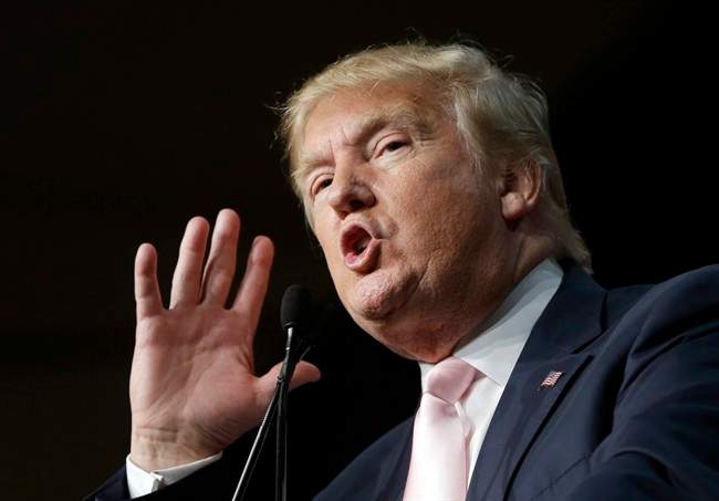 Republican presidential candidate Donald Trump gestures as he addresses supporters during a campaign stop at the Trump National Doral Miami resort, Friday, Oct. 23, 2015 in Doral, Fla. (AP Photo/Alan Diaz).
