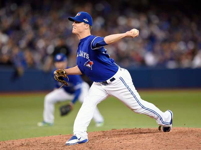 Toronto Blue Jays' Aaron Loup works against the Texas Rangers during twelfth inning of game two American League Division Series baseball action in Toronto on Friday, Oct. 9, 2015.