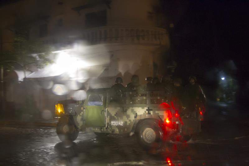 Mexican soldiers patrol streets during the arrival of hurricane Patricia in Puerto Vallarta, Mexico on October 23 ,2015. Monster Hurricane Patricia roared toward Mexico’s Pacific coast on Friday, prompting authorities to evacuate villagers, close ports and urge tourists to cancel trips over fears of a catastrophe.