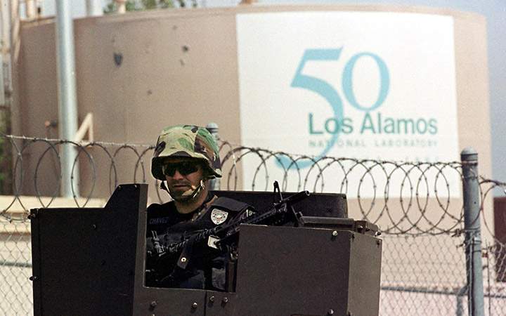 An armed guard keeps a watchful eye over the Los Alamos National Laboratory in Los Alamos, New Mexico.