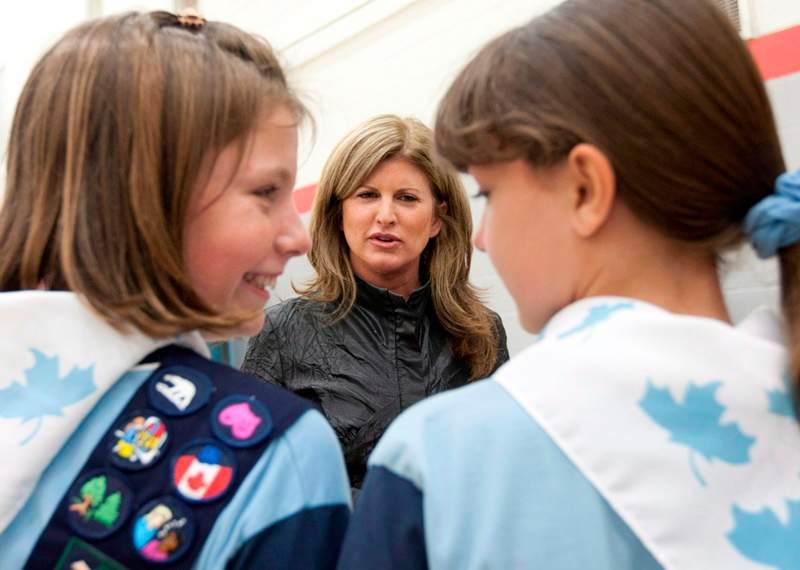 Rona Ambrose speaks with two Girl Guides before launching a call for proposals for Women's History month at an event in Ottawa, Tuesday June 5, 2012. Ambrose is now effectively in charge of one of the toughest files in government, the F-35 fighter jet purchase.