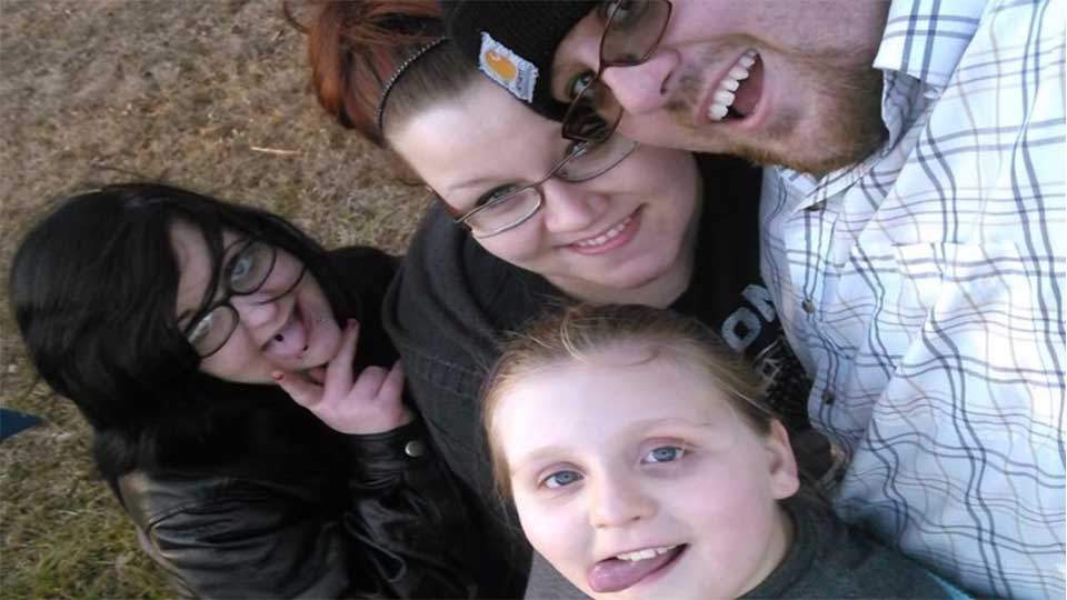 Justin McCary, seen here with his wife Elizabeth, daughter Haley and Mercedes Alexis Peters (far left).