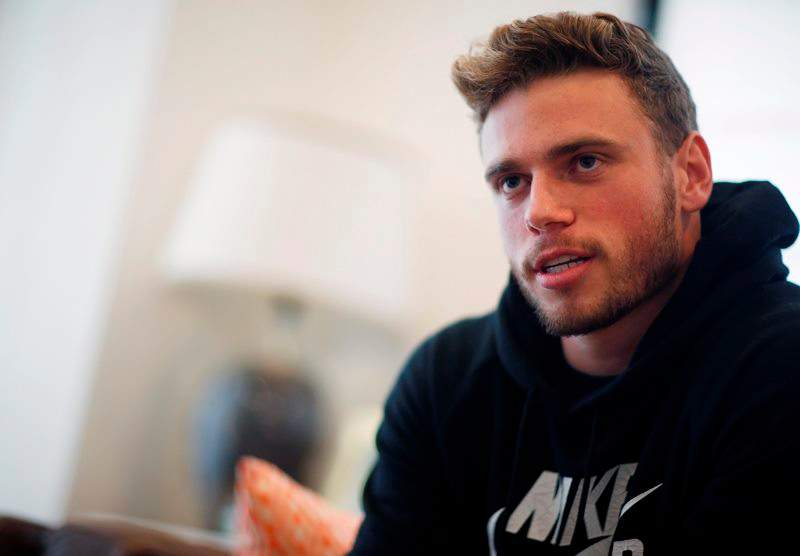 In this Wednesday, Oct. 21, 2015, photo, Gus Kenworthy, a freestyle skier who won a silver medal in Sochi, poses in his home in Denver. 