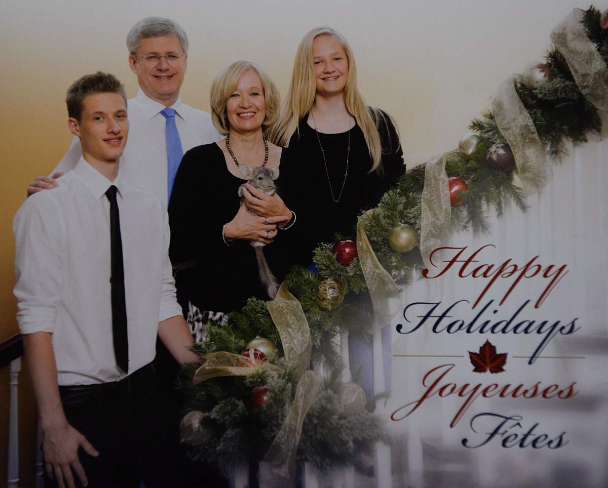Prime Minister Stephen Harper is pictured with his son Ben, wife Laureen, holding Charlie the chinchilla, and daughter Rachel on their 2013 holiday card seen in Ottawa on Wednesday, Nov. 20, 2013.