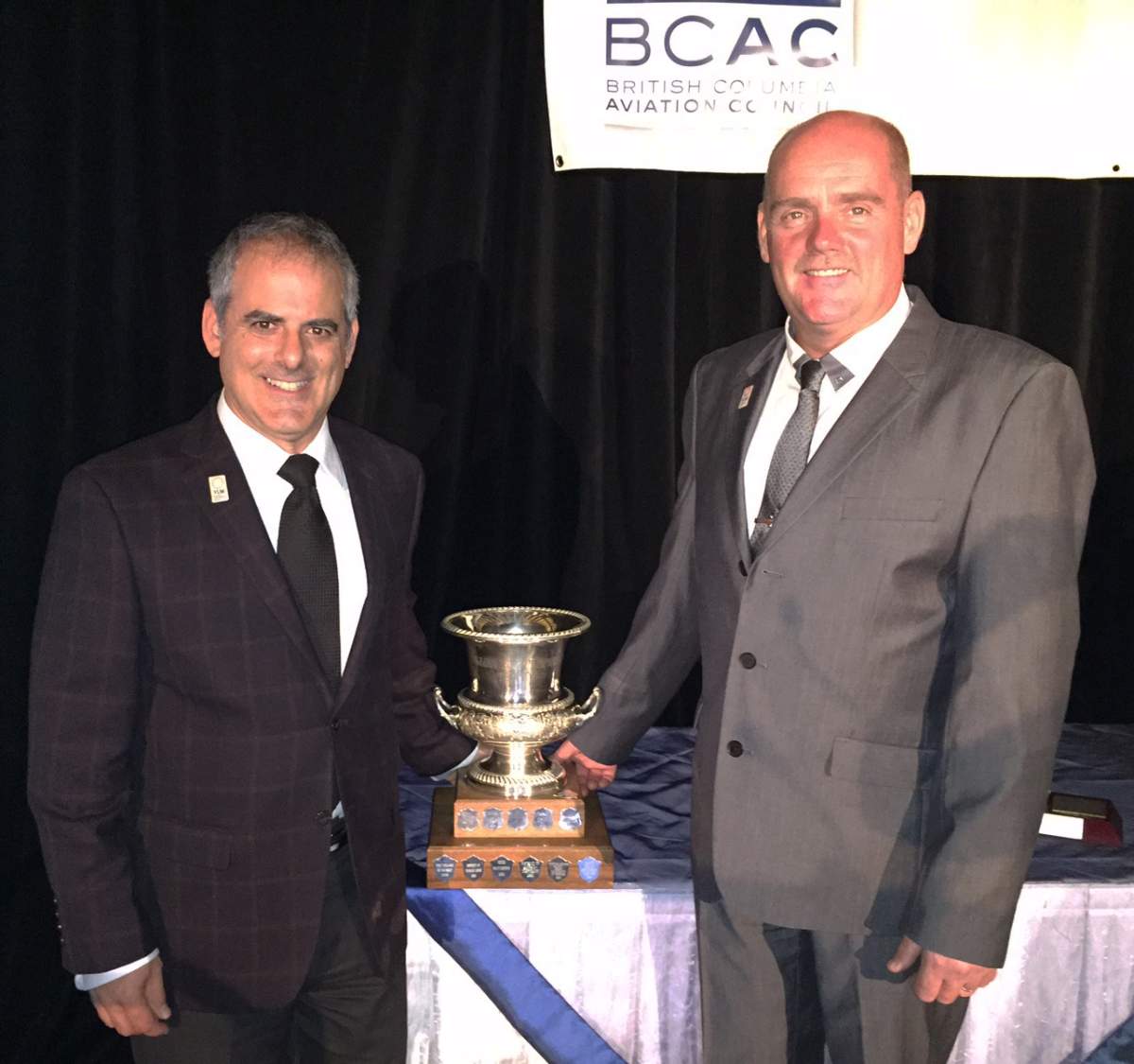Phillip Elchitz, Senior Manager, Airport Development, left, and Airport Operations Specialist/Firefighter Crew Captain Kevin Vleeming accept the William Templeton Award.
