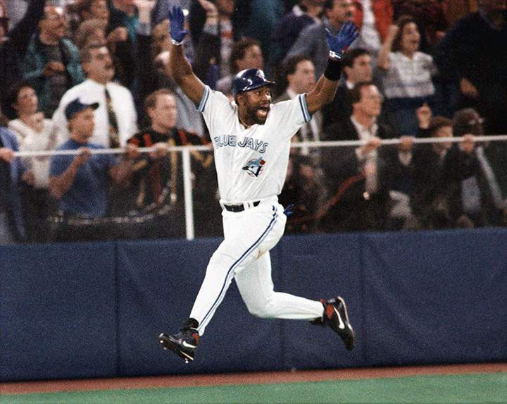 In this Oct. 23, 1993, file photo, Toronto Blue Jays’ Joe Carter celebrates his game-winning, three-run home run in the ninth inning of Game 6 of the World Series in Toronto.