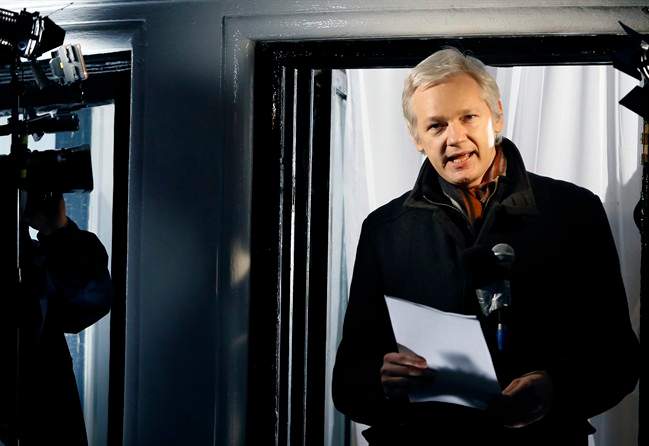 FILE - In this Thursday, Dec. 20, 2012, file photo, Julian Assange, founder of WikiLeaks speaks to the media and members of the public from a balcony at the Ecuadorian Embassy in London. 