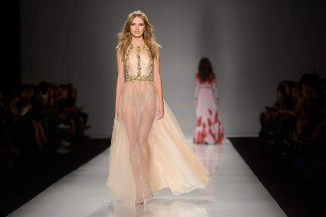 A model walks the runway in the Lucian Matis show, part of Fashion Week in Toronto on Tuesday October 20, 2015. 