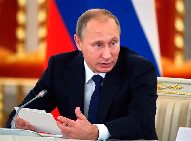 Russian President Vladimir Putin speaks as he heads a meeting of the Presidential Council for Civil Society and Human Rights at the Alexadrovsky Hall in the Kremlin in Moscow, Russia, Thursday, Oct. 1, 2015. (Yuri Kochetkov/Pool photo via AP).