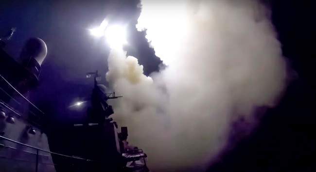 In this photo made from the footage taken from Russian Defense Ministry official web site, Wednesday, Oct. 7, 2015, a Russian navy ship launches a cruise missile in the Caspian Sea. Russia's Defense Minister Sergei Shoigu said four Russian navy ships in the Caspian launched 26 cruise missiles at Islamic State targets in Syria.().