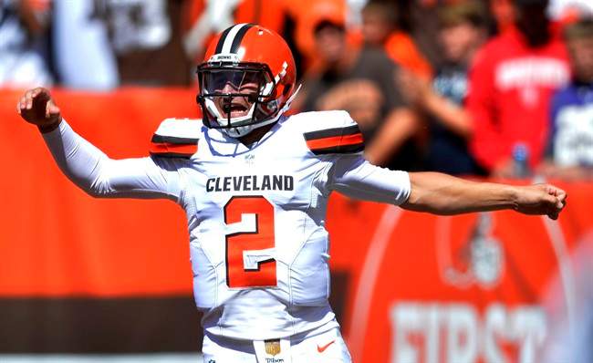 FILE - In this Sunday, Sept. 20, 2015 file photo, Cleveland Browns quarterback Johnny Manziel celebrates after a 60-yard touchdown pass to wide receiver Travis Benjamin in the first half of an NFL football game against the Tennessee Titans in Cleveland.