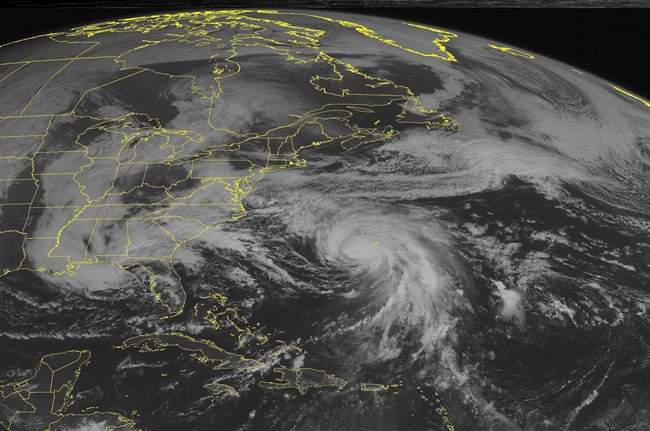 This NOAA satellite image taken Sunday, Oct. 4, 2015. at 9:45 AM EDT shows slowly weakening Hurricane Joaquin southwest of Bermuda, moving in a north-northeast direction.