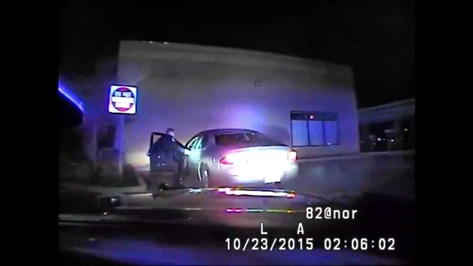 Caught on camera: Michigan woman slams car into police officer after traffic stop - image