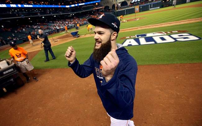 Houston Astros' Dallas Keuchel smiles as he gestures to the stands after winning Game 3 of baseball's American League Division Series against the Kansas City Royals Sunday, Oct. 11, 2015, in Houston. The Astros won 4-2.