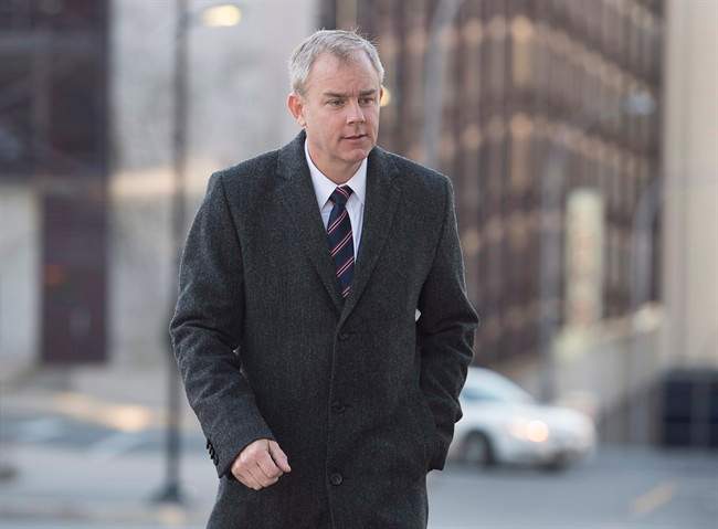 Dennis Oland heads to the Law Courts as his murder trial continues in Saint John, N.B., on Wednesday, October 21, 2015.