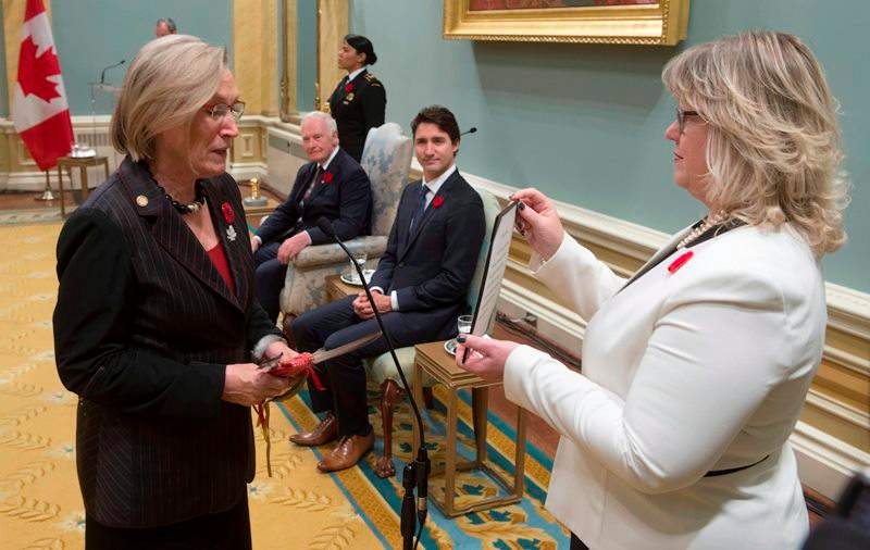 Governor General David Johnston and Prime Minister Justin Trudeau look on as Carolyn Bennett is sworn in as the Minister of Indigenous and Northern Affairs during ceremonies at Rideau Hall, Wednesday Nov.4, 2015 in Ottawa.