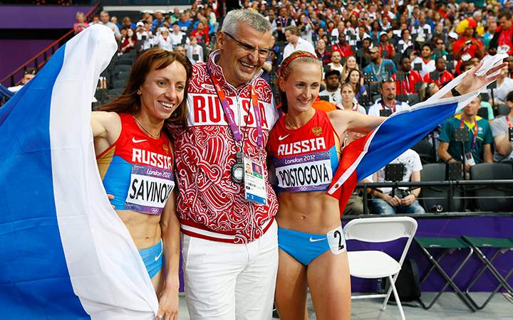 Mariya Savinova and Ekaterina Poistogova of Russia celebrate with Russian coach Vladimir Kazarin after placing first and third in the women’s 800-metre final at the London 2012 Olympic Games.