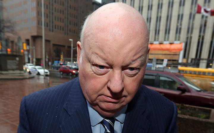 Sen. Mike Duffy, a former member of the Conservative caucus, arrives at the courthouse for his trial on Friday, November 27, 2015 in Ottawa. 