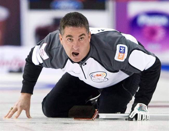 Skip Wayne Middaugh yells after throwing his rock while playing against Team Howard during the 2009 Canadian Olympic Curling Trials in Edmonton on Monday, Dec. 7, 2009. The 2012 world champion has returned to the Brier with his old teammate, Glenn Howard.