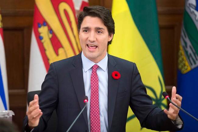Prime Minister Justin Trudeau delivers some opening remarks at the start of caucus, Thursday, November 5, 2015 in Ottawa. THE CANADIAN PRESS/Adrian Wyld.