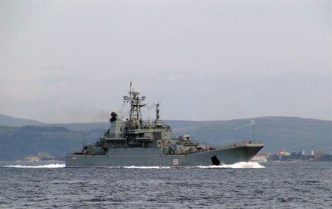 Russian warship is seen passing through the Dardanelles Strait en route to the Mediterranean Sea, near Canakkale, Turkey, Tuesday, Nov. 24, 2015. 