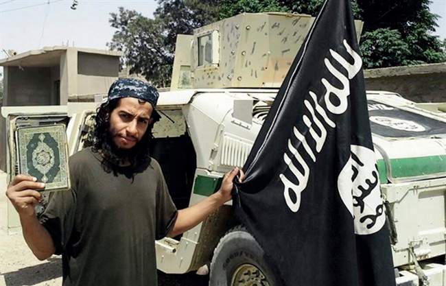 This undated image made available in the Islamic State's English-language magazine Dabiq, shows Belgian Abdelhamid Abaaoud. Abated who was identified by French authorities on Monday, Nov. 16, 2015, is the presumed mastermind of the attacks last Friday in Paris. A senior police official on Wednesday, Nov. 18, 2015, said he believed the Belgian Islamic State militant was inside an apartment in the Paris suburb of Saint-Denis with other heavily armed people.