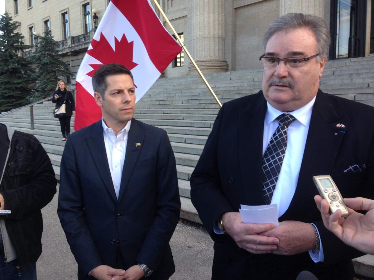 Honourary French Consul Bruno Burnichon and Mayor Brian Bowman attend a vigil after the attacks in Paris.