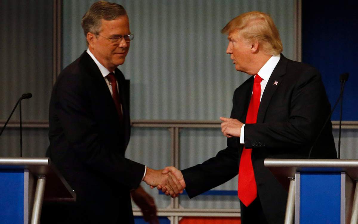 Jeb Bush and Donald Trump shake hands after the Republican presidential debate at the Milwaukee Theatre, Tuesday, Nov. 10.