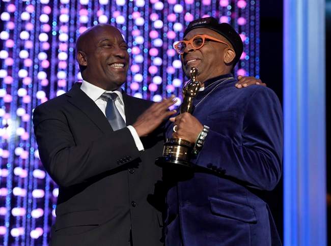 John Singleton, left, and Spike Lee, honorary Oscar recipient, pose onstage at the Governors Awards at the Dolby Ballroom on Saturday, Nov. 14, 2015, in Los Angeles. 