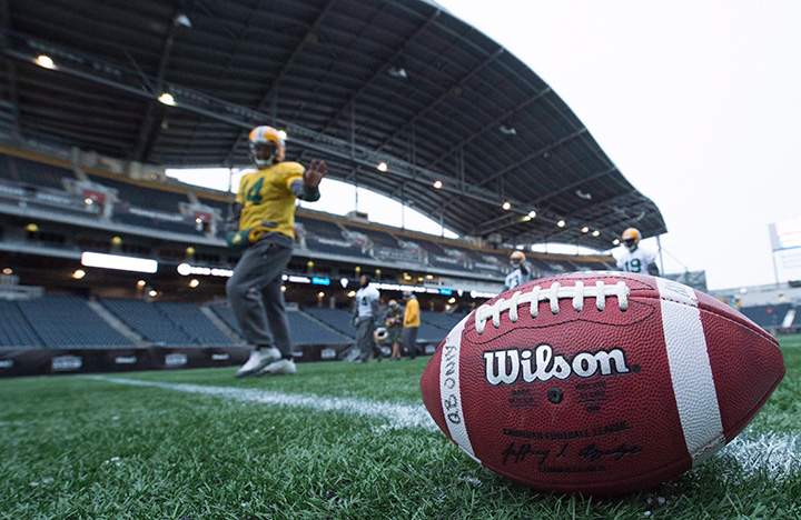 Edmonton Eskimos players warm up during a team practice in Winnipeg, Man. Wednesday, Nov.25, 2015. 