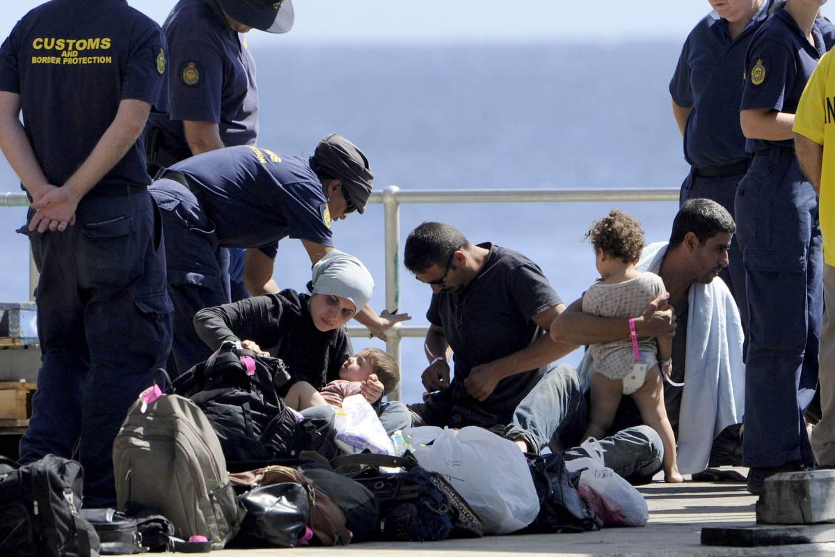 The 162 asylum seekers on board a boat that refused to turn back to Indonesia despite reporting it was in distress arrived at Christmas Island yesterday after travelling the final 200km of their journey on navy ships. 