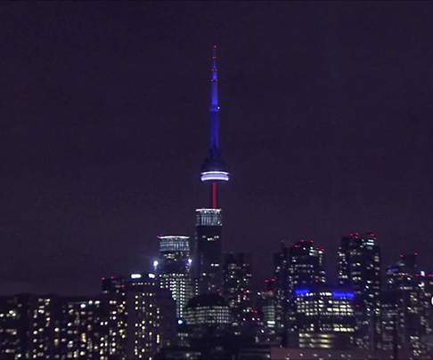 The CN Tower has been lit up in the colours of the French flag in the wake of the Paris attacks.