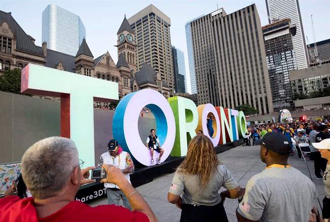 Athletes pose for photos at the closing ceremony of the Parapan Am Games in Toronto on Saturday, August 15, 2015.