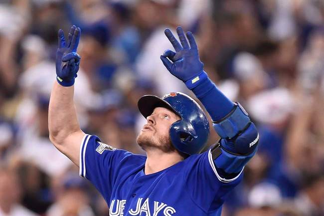 FILE -- Toronto Blue Jays' Josh Donaldson reacts as he crosses the plate after hitting a two-run home run against the Kansas City Royals during third inning game three American League Championship Series baseball action in Toronto on Monday, Oct. 19, 2015. Donaldson has been named the American League MVP. THE CANADIAN PRESS/Frank Gunn.