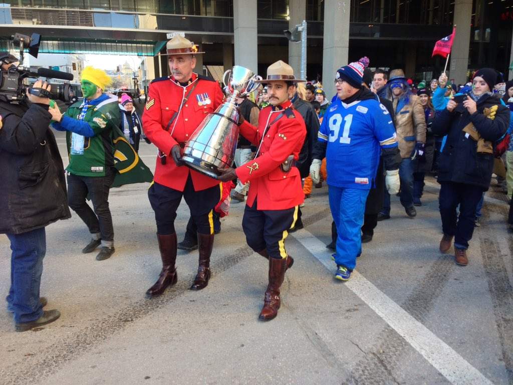 The Grey Cup beginning its final march to The Forks where it will be flown to IGF.
