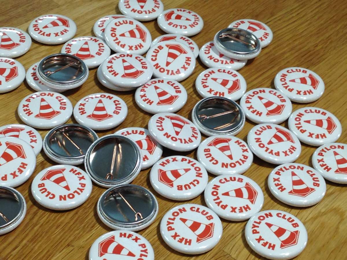 Pylon Club pins.